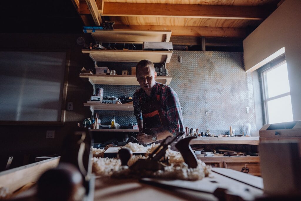 a man working in a woodworking shop